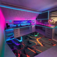 a room with neon lights in the ceiling and desks on the floor, all lit up