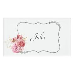 a name plate with pink flowers and pearls on the border, in silver lettering that says julia