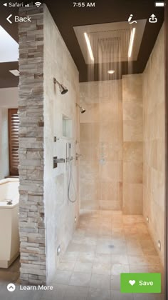 a walk in shower sitting next to a white tub