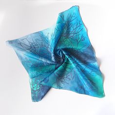 Square Silk Scarf with Navy Blue Tree Silhouette Pattern on a Grayish Blue-Turquoise Background This exquisite silk pocket square is ready to be shipped to you! Size:  55 by 55 centimeters (23" by 23") 88 by 88 centimeters (34" by 34") Silk: Pure Habotai Light - semi-transparent and subtly glossy. This foulard has been personally hand-painted by me directly onto silk! The intricate design won't fade or wash off, and it's visible on both sides of the scarf. Care Instructions: Please hand wash onl Bohemian Blue Silk Scarf Gift, Bohemian Blue Silk Scarf For Gift, Bohemian Blue Silk Scarf As Gift, Artistic Hand Dyed Blue Silk Scarf, Artistic Blue Silk Scarves, Artistic Blue Silk Scarf, Artistic Handmade Blue Silk Scarf, Handmade Blue Scarf As A Gift, Handmade Blue Scarves As Gifts