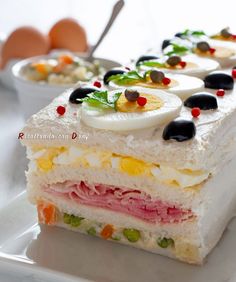 there are many different types of food on this white plate with eggs in the background