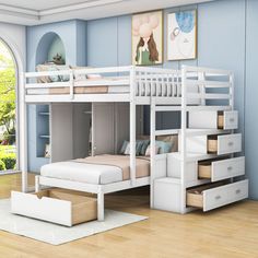 a white bunk bed sitting next to a window in a blue room with wooden floors