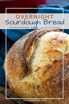 a loaf of sourdough bread sitting on top of a cooling rack with the words overnight sourdough bread