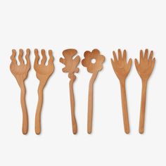 Designed by Selena Liu for Areaware, Serving Friends are Sapele wooden spoons carved into charming shapes that bring joy and humor to your dining table.