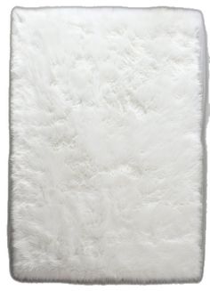 a white sheepskin rug on a white background