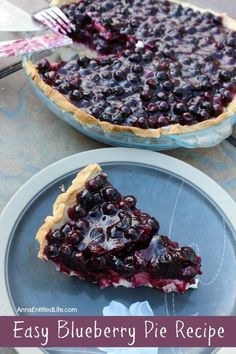 a blueberry pie on a plate with a fork