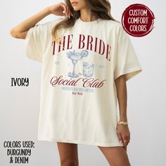 a woman wearing a white t - shirt with the words, the bride social club on it