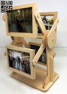 three wooden frames with pictures attached to them