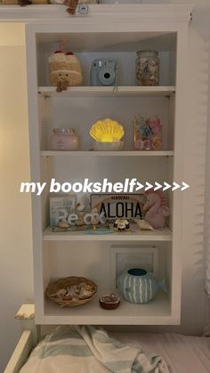 an open book shelf in the corner of a bed