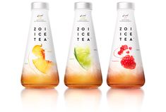 three bottles of tea with fruit on them