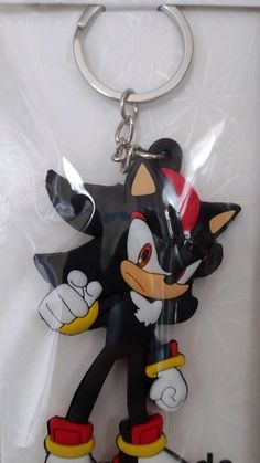 an image of a keychain that is shaped like sonic the hedgehog