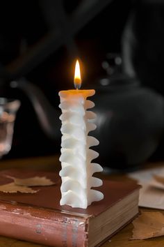 a candle that is sitting on top of a book