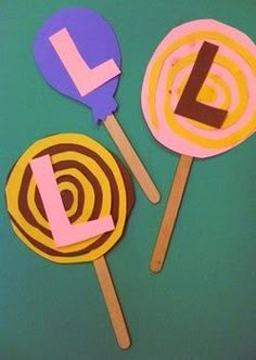 two lollipops with the letter l on them