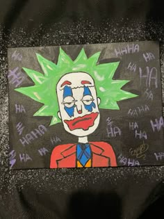 a painting of a clown with green hair and blue eyes on a black background that has writing all over it