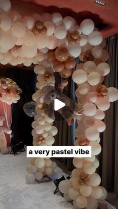 a very pastel vibe balloon arch for a party