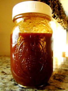 a jar filled with some kind of food on top of a counter