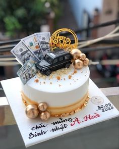 a cake decorated with money and gold decorations