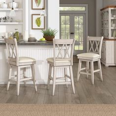 an image of a kitchen setting with white furniture and wood flooring in color swatches