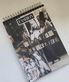 a spiral notebook with photos of models on the front and back cover, in black and white