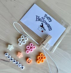 the craft kit is ready to be used for halloween decorations, including beads and magnets