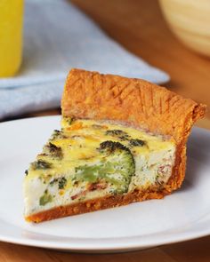 a slice of broccoli quiche on a white plate