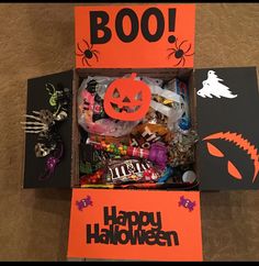 an open halloween box filled with candy and candies