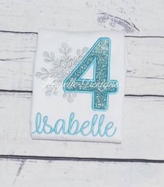 the number four is made out of white fabric with blue and silver sequins