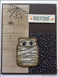 a close up of a greeting card with a spider on it and a trick to the treat tag