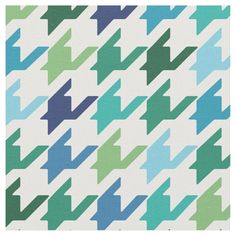 an abstract pattern with blue, green and purple arrows on white fabric in the shape of rectangles