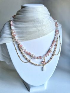 Introducing our enchanting Cottagecore Necklace, meticulously handcrafted to capture the essence of fairy tales and natural beauty. This multi-layered piece features a stunning combination of pearls, sparkling crystals, and morganite chipped stones, along with delicate pink jade accents. Each layer is thoughtfully designed to create a mesmerizing effect, perfect for adding a touch of whimsy to any outfit. Crafted with care, this unique necklace measures approximately 18 inches in length, making Cottagecore Necklace, Handmade Fairy, Pink Jade, Whimsical Gifts, Fairy Jewelry, Unique Necklace, Choker Necklaces, Sparkling Crystal, Necklace Handmade