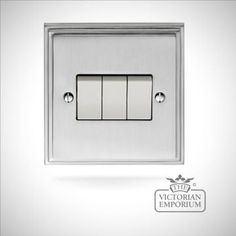 a light switch with three lights on each side and the word victoria emporum above it