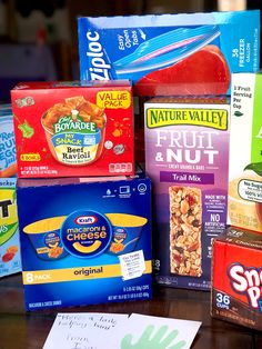 several boxes of cereal are stacked on top of each other, including fruit and nuts