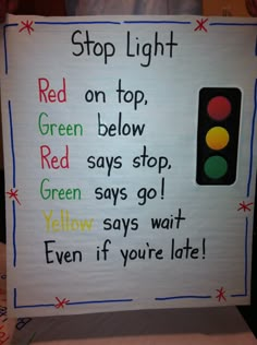 a sign that says stop light on top, green below and red below the lights