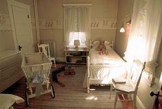 a bedroom with two twin beds and a baby crib