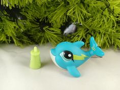 Littlest Pet Shop dolphin #65. Pet is in excellent nice clean condition. White Accents, Blue Teal, Green Eyes, Dolphins