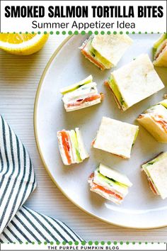 small sandwiches on a plate with lemons in the background and text overlay that reads smoked salmon tortilla bites summer appetizer idea