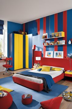 a bedroom with blue, yellow and red walls