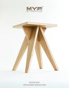 a small wooden table sitting on top of a white floor