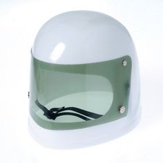 a white helmet with green visor on it