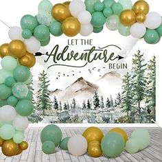 an arch made out of balloons with the words let the adventure begin