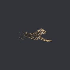 the silhouette of a cheetah is shown in gold on a dark background with small dots