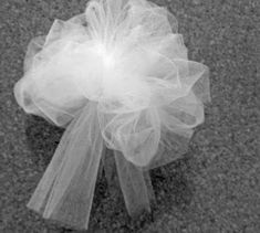 a tulle bow on the ground in black and white