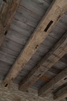 an old wooden ceiling with exposed wood beams