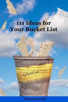 a bucket full of papers flying in the air with text that reads 11 ideas for your bucket list