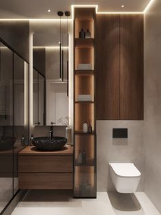 a bathroom with a toilet, sink and shelving unit in the middle of it