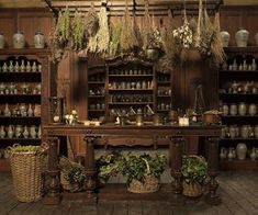 an old fashioned kitchen with many pots and pans