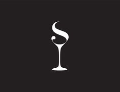 a white wine glass on a black background with the letter s in it's center