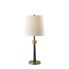 a table lamp with a white shade on top and a gold base, against a white background