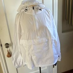 White Hooded Windbreaker Athleisure, White Windbreaker With Adjustable Hood, White Hooded Cotton Windbreaker, White Long Sleeve Windbreaker With Drawstring Hood, White Hooded Moisture-wicking Windbreaker, Champion Jacket, Pullover Jacket