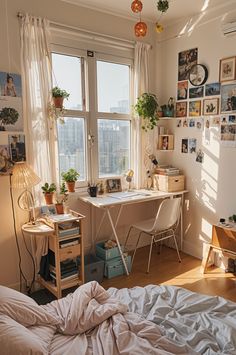 a bedroom with a bed, desk and window overlooking the cityscape is pictured in this image